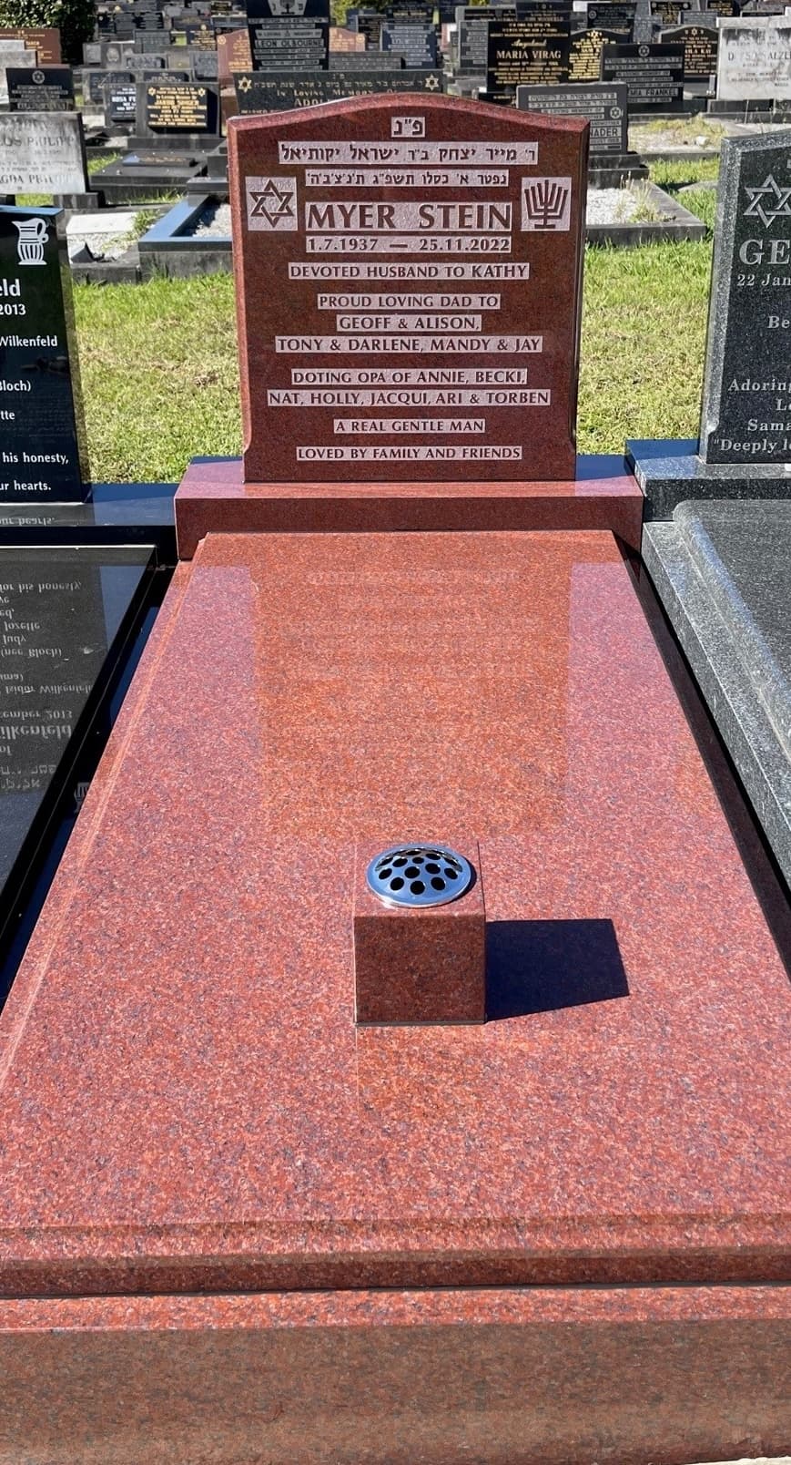 Single monument with Balmoral Red granite and natural raised lettering.