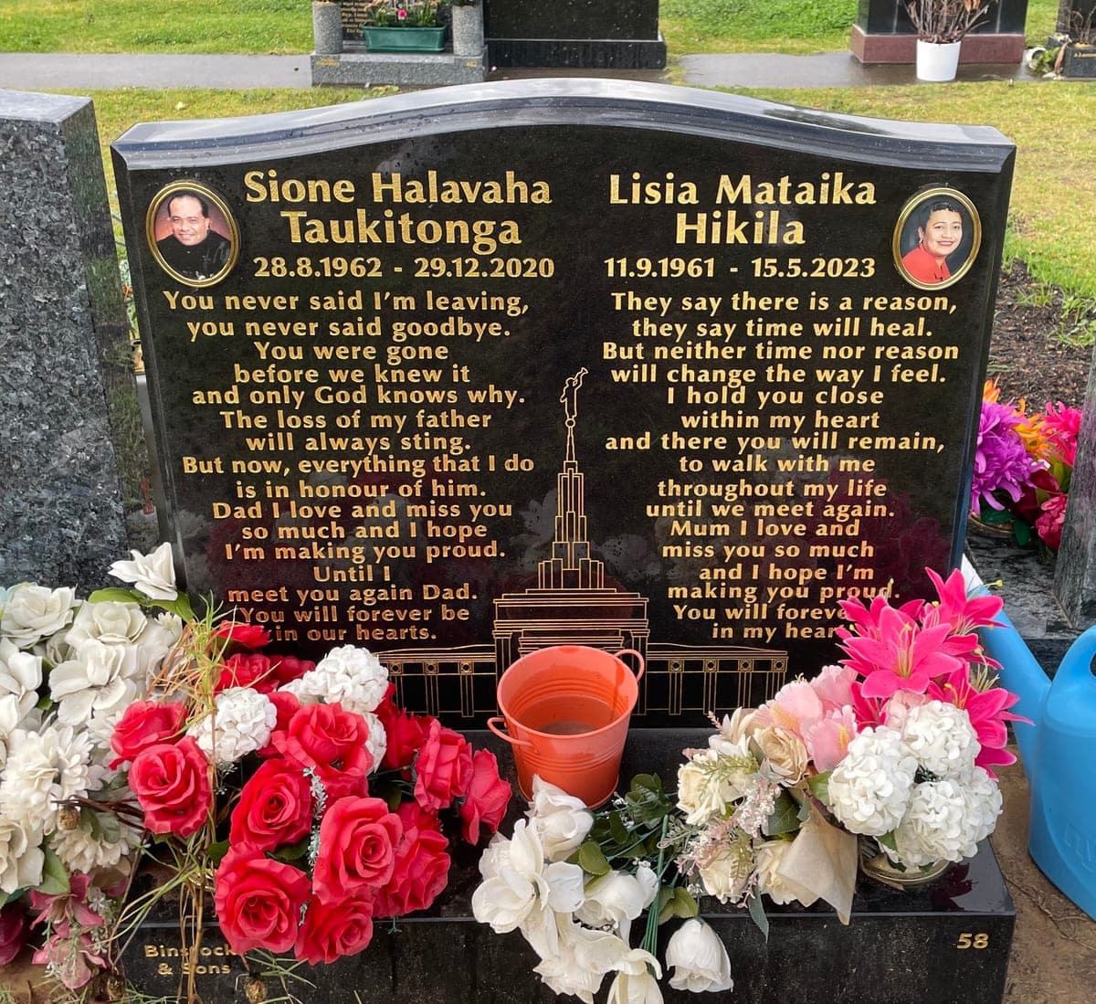 Double monument with a serpentine-shaped headstone, base, gold leaf lettering, and jet black granite.